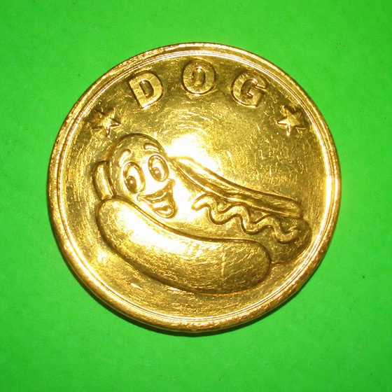 A fake gold coin with a hot dog on it