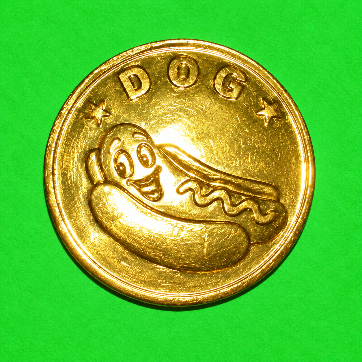 DOG gold coin logo with a smiling hot dog on bright green